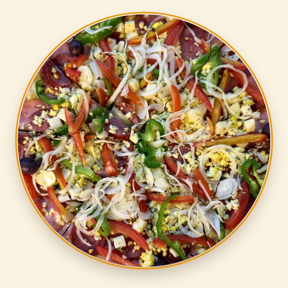 Pizza da Mamma's Gourmet vista de cima, com cobertura completa